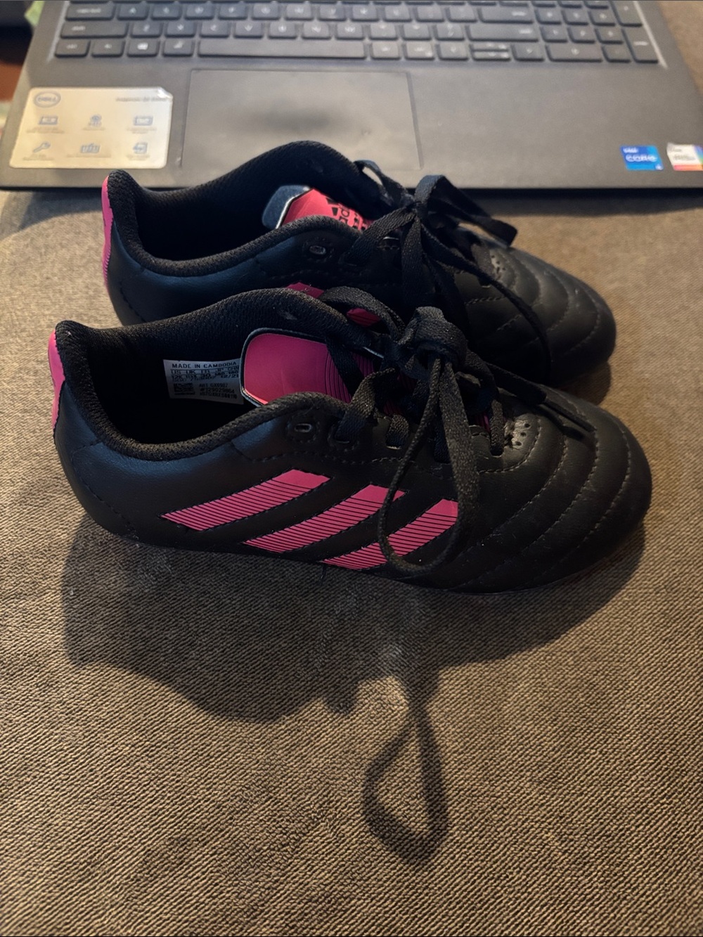 Adidas pink and black cleats